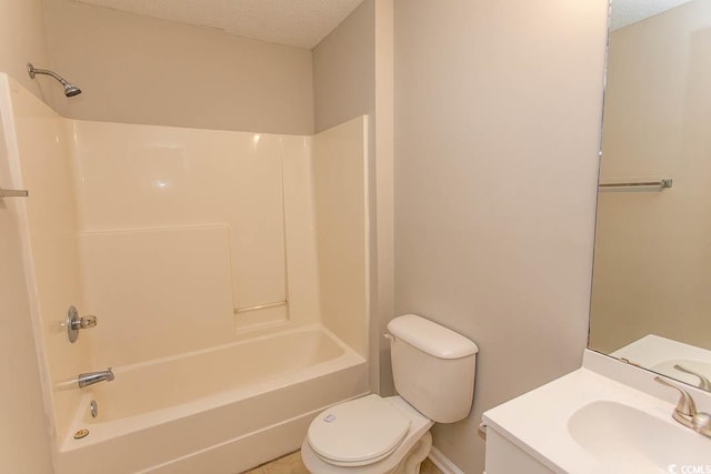 full bathroom with toilet, bathtub / shower combination, a textured ceiling, and vanity