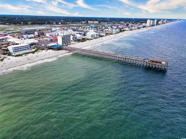 aerial view with a water view and a beach view