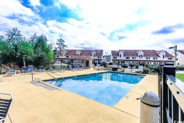 view of swimming pool with a patio