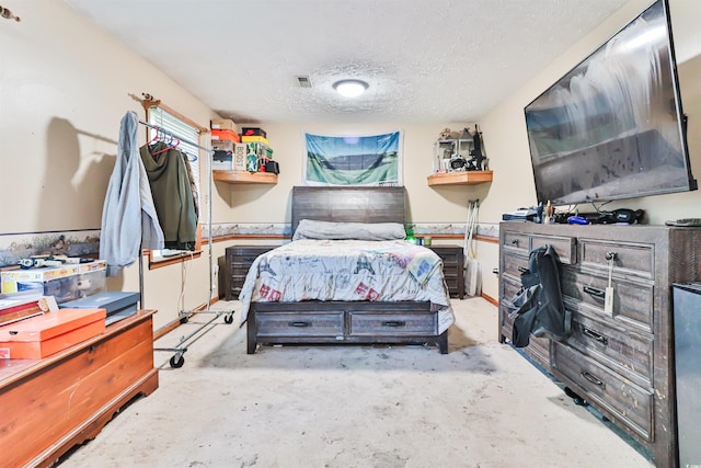 bedroom featuring a textured ceiling