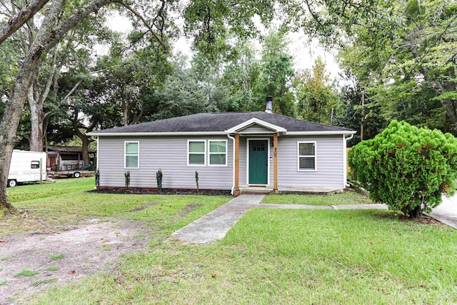 ranch-style house with a front lawn