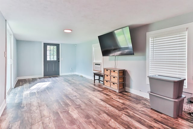 unfurnished living room with hardwood / wood-style flooring