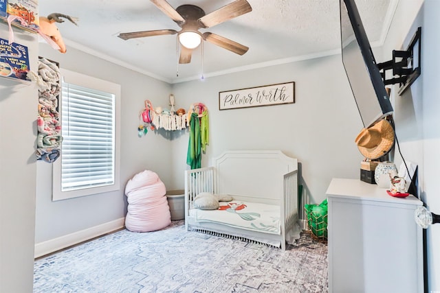 bedroom with a textured ceiling, ornamental molding, and ceiling fan