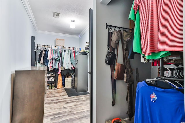 spacious closet featuring hardwood / wood-style floors