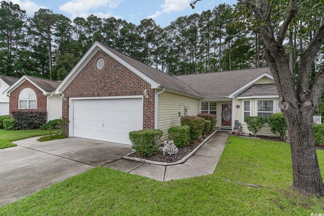 ranch-style home featuring a garage and a front yard