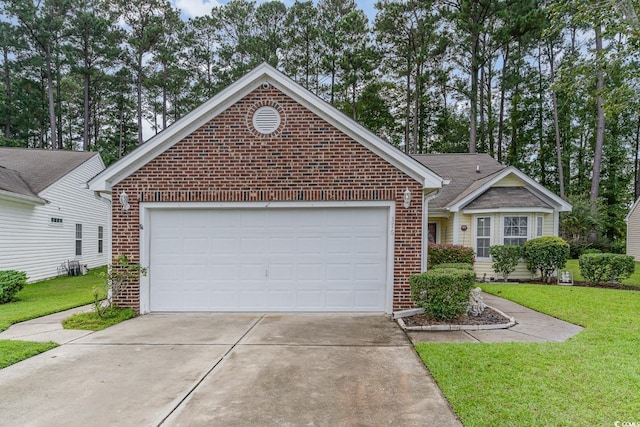 ranch-style home with a garage and a front lawn