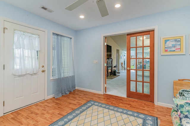 entrance foyer featuring wood-type flooring and ceiling fan