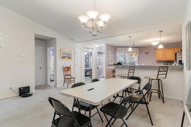 carpeted dining space with a notable chandelier