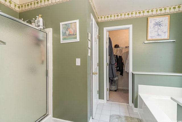 bathroom with tile patterned floors and separate shower and tub