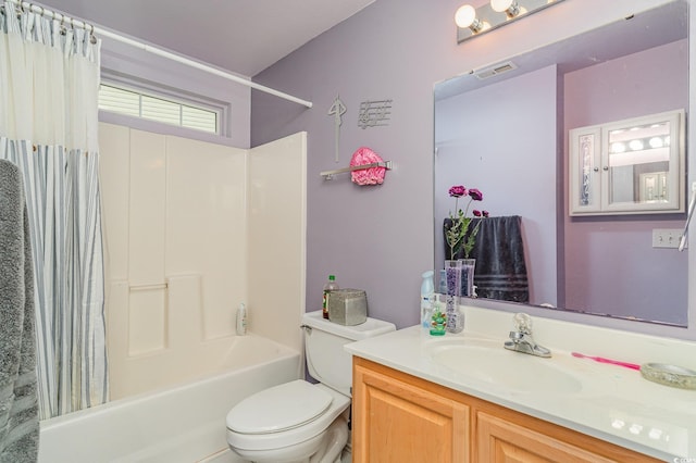 full bathroom with vanity, toilet, and shower / bath combo