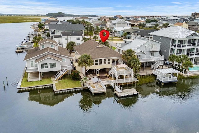 exterior space featuring a deck with water view