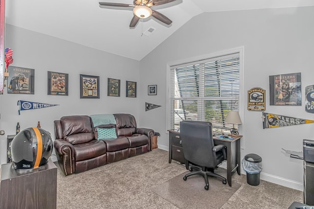 carpeted office space with vaulted ceiling and ceiling fan