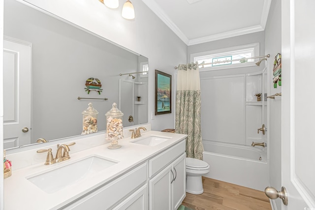 full bathroom with vanity, crown molding, hardwood / wood-style flooring, shower / tub combo with curtain, and toilet