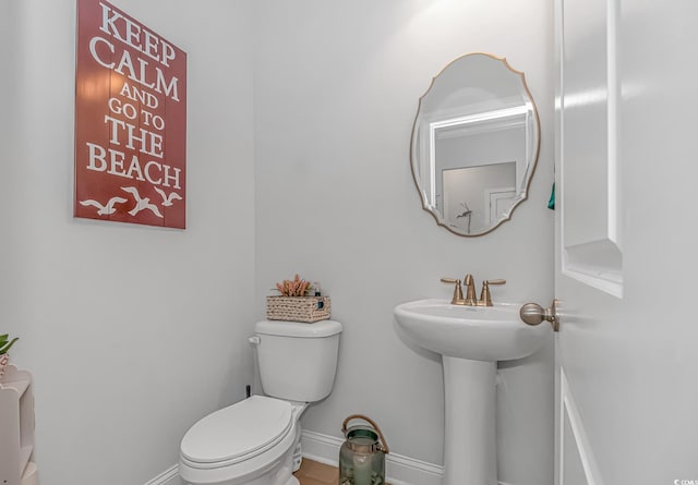 bathroom featuring sink and toilet