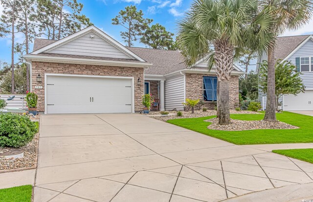 view of front of property with a garage