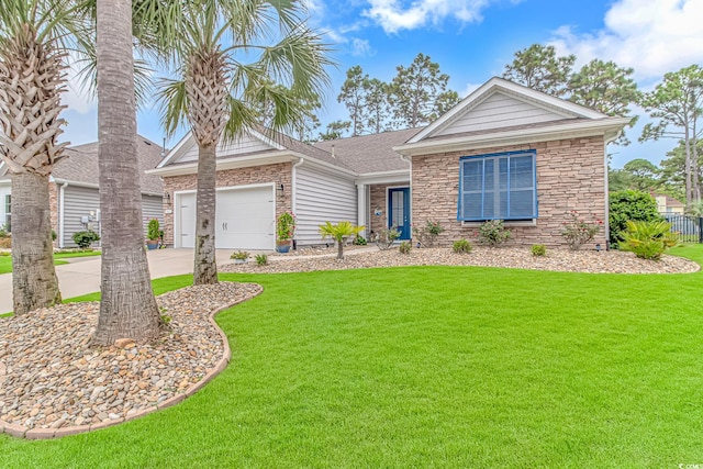 view of front of property with a front lawn and a garage