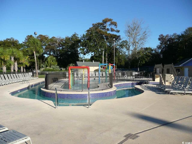 view of swimming pool with a patio area