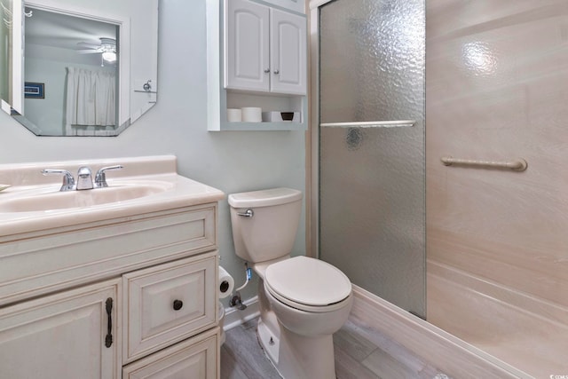 5905 S Kings Hwy Unit 416-B, Myrtle Beach, SC 29575 - full bath with a shower stall, vanity, wood finished floors, and ceiling fan