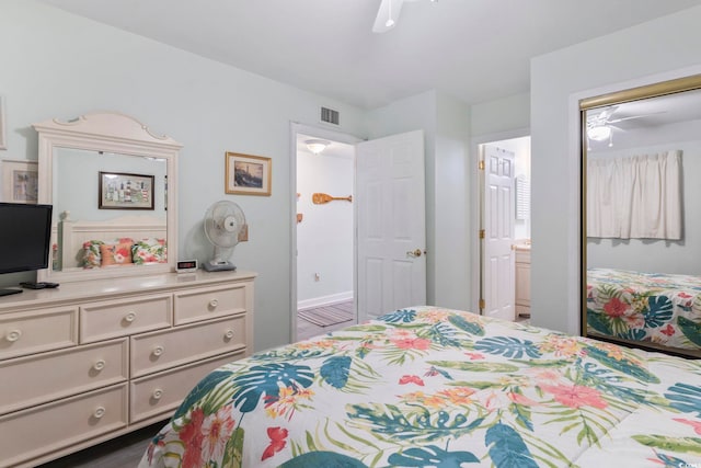 bedroom featuring ensuite bath, ceiling fan, and dark hardwood / wood-style flooring