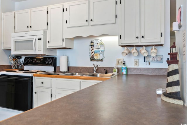 5905 S Kings Hwy Unit 416-B, Myrtle Beach, SC 29575 - kitchen with white appliances, white cabinetry, and dark countertops