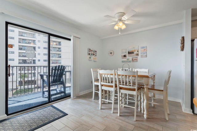 dining space featuring ceiling fan, light hardwood / wood-style floors, and a wealth of natural light