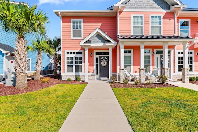 craftsman-style home featuring a porch and a front lawn