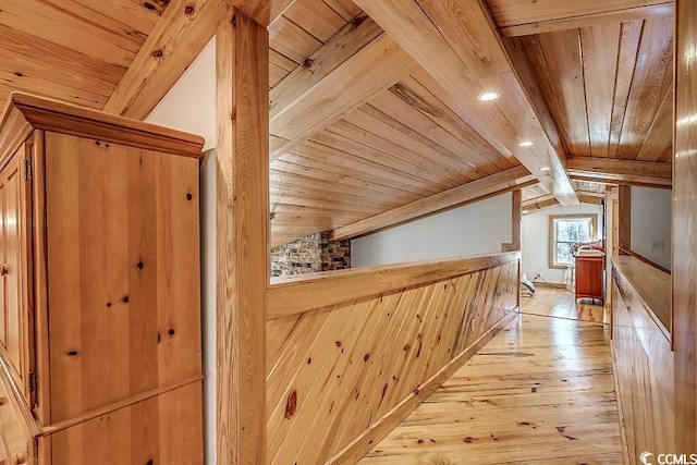 bonus room with wooden ceiling, vaulted ceiling with beams, and light hardwood / wood-style floors