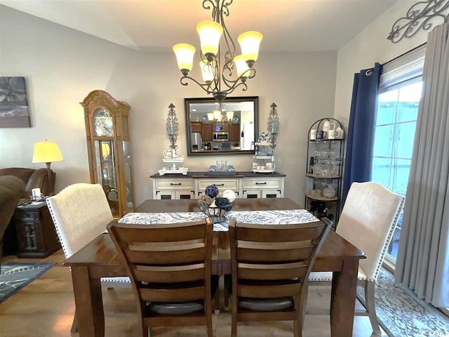 dining space featuring an inviting chandelier