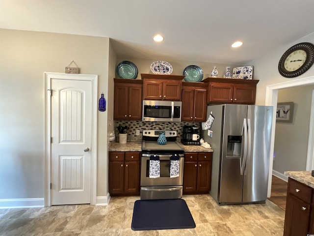 kitchen with light stone counters, recessed lighting, baseboards, appliances with stainless steel finishes, and decorative backsplash