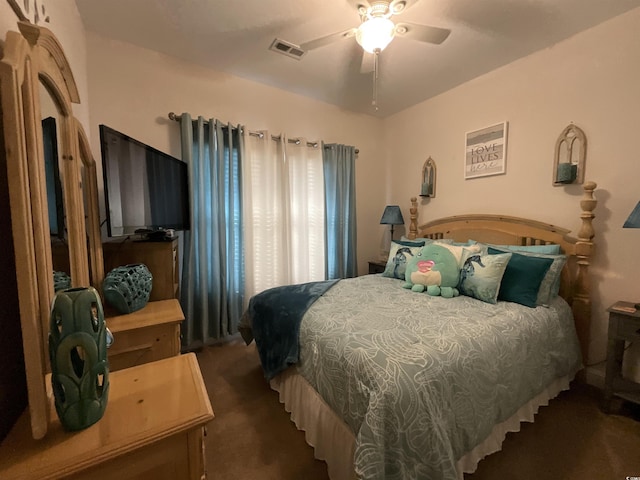 bedroom with carpet, visible vents, and a ceiling fan