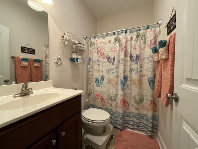 full bath featuring shower / bath combo, vanity, and toilet