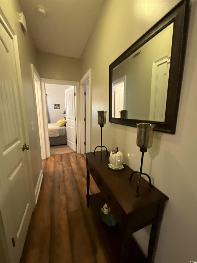 corridor featuring dark wood-style floors