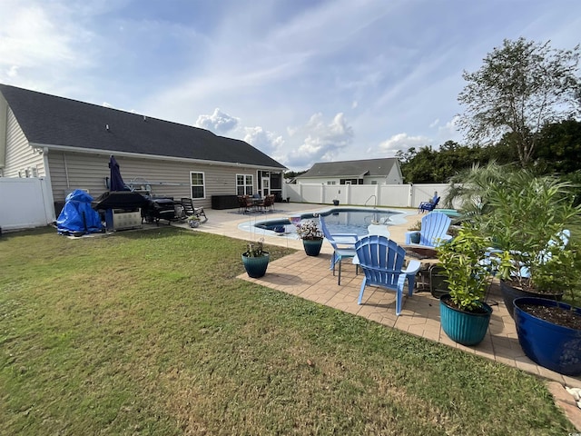 view of pool featuring a lawn, a patio area, a fenced backyard, and a fenced in pool