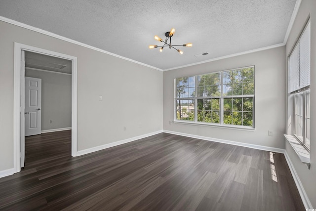 empty room with a textured ceiling, an inviting chandelier, dark hardwood / wood-style floors, and ornamental molding