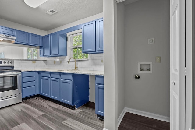 kitchen with stainless steel electric stove, hardwood / wood-style floors, sink, light stone countertops, and blue cabinetry