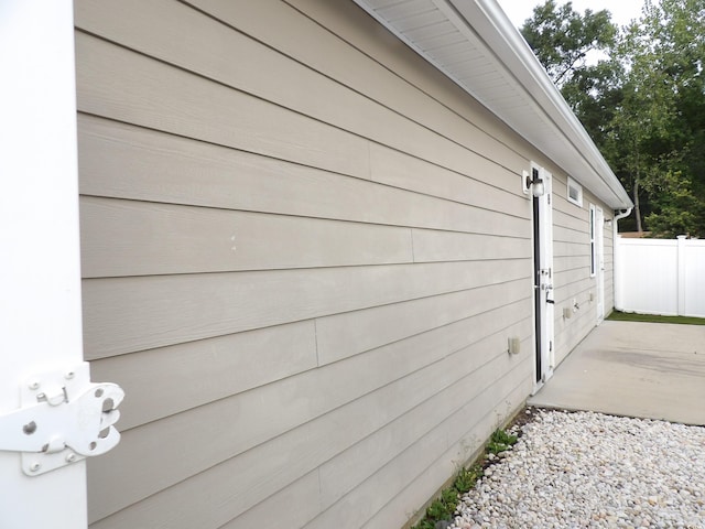 view of side of home featuring a patio area