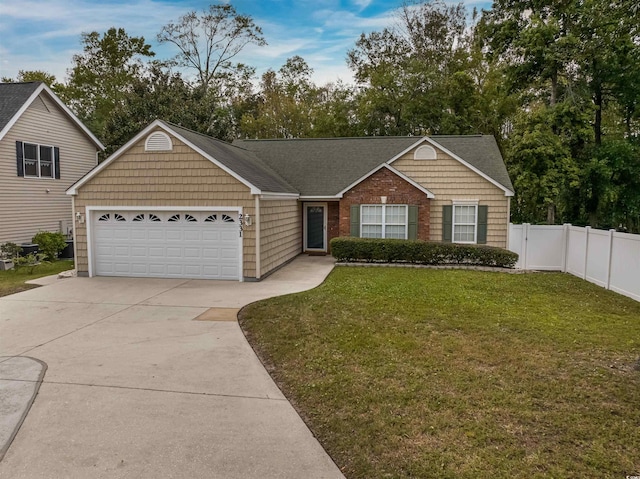 view of front of home with a garage and a front lawn