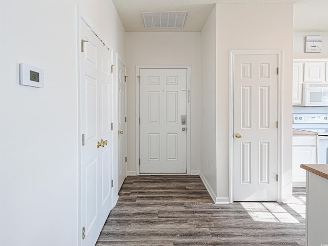 2060 Cross Gate Blvd Unit 305, Surfside Beach, SC 29575 - hall with dark wood-style flooring and baseboards