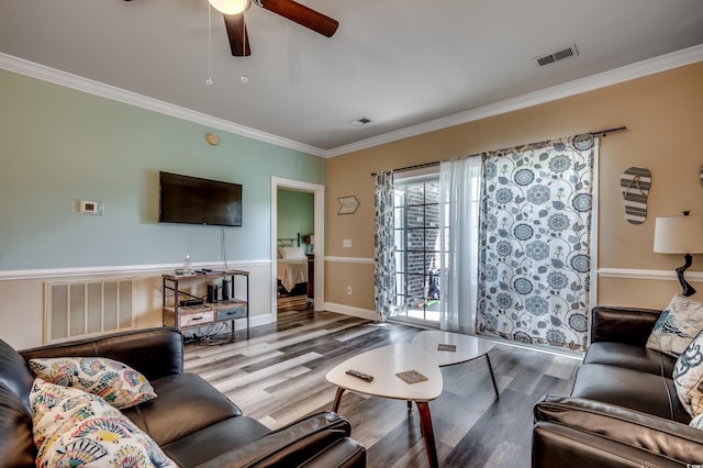 living room with ceiling fan, hardwood / wood-style flooring, and crown molding