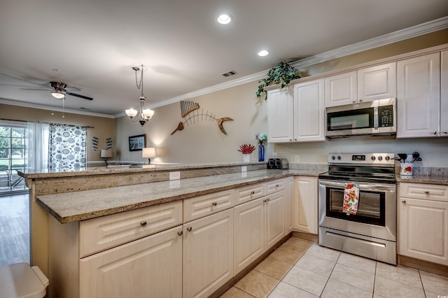 kitchen with ornamental molding, stainless steel appliances, and kitchen peninsula