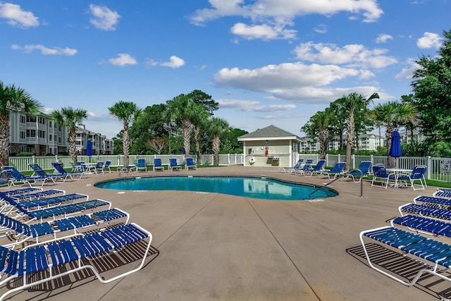 view of swimming pool with a patio area