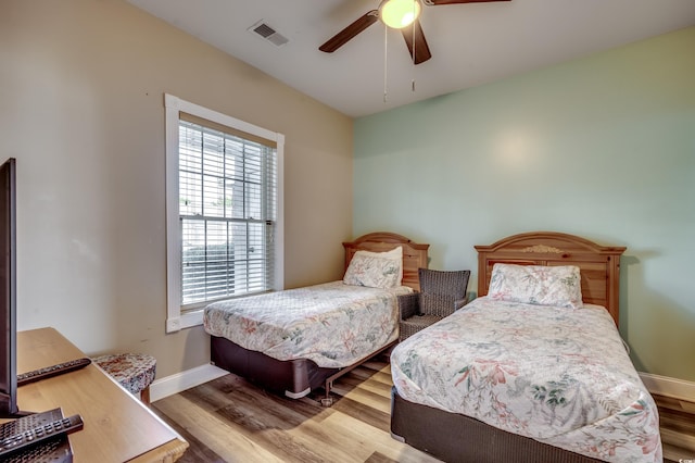 bedroom featuring light hardwood / wood-style floors and ceiling fan