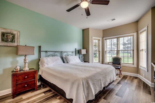 bedroom featuring wood-type flooring and ceiling fan