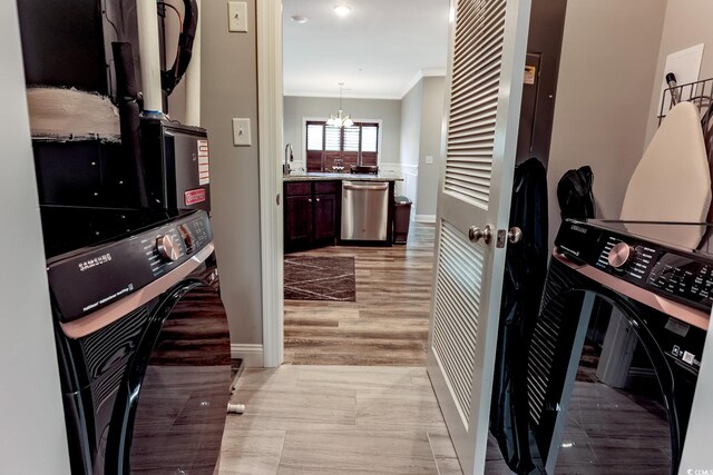949 Jackline Pl Unit 103, Murrells Inlet, SC 29576 - kitchen featuring stainless steel dishwasher, crown molding, a chandelier, baseboards, and a sink