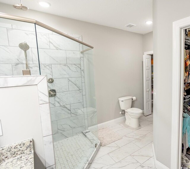 949 Jackline Pl Unit 103, Murrells Inlet, SC 29576 - full bathroom featuring marble look tile flooring, a spacious closet, a shower stall, toilet, and recessed lighting