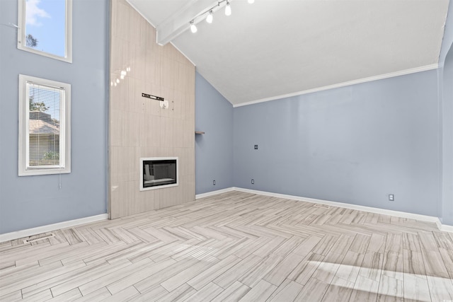 unfurnished living room featuring light wood-type flooring, a tiled fireplace, beamed ceiling, and high vaulted ceiling