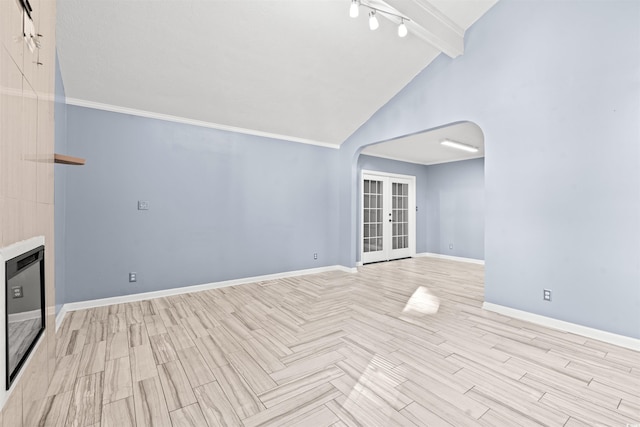 unfurnished living room with high vaulted ceiling, light wood-type flooring, beamed ceiling, and french doors