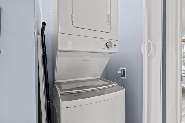 laundry area featuring stacked washer and clothes dryer