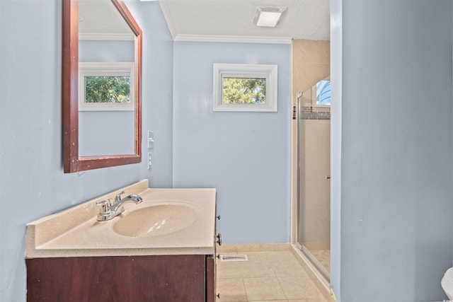 bathroom with vanity, ornamental molding, an enclosed shower, and tile patterned floors