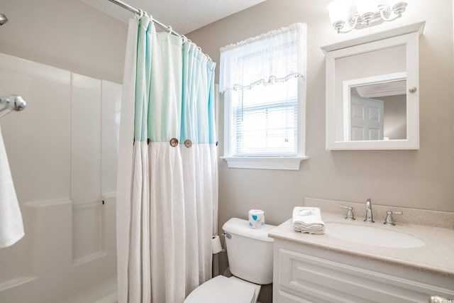 full bath featuring toilet, a shower with shower curtain, and vanity